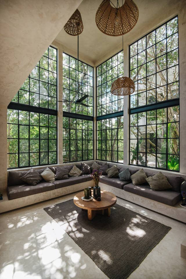 living room with muntin floor to ceiling windows